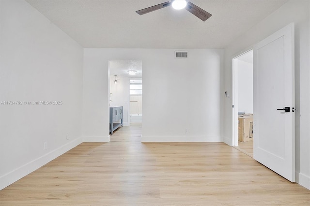 4050 NW 42nd Ave Unit 318, Fort Lauderdale, FL 33319 - empty room featuring ceiling fan, light hardwood / wood-style flooring, and a textured ceiling