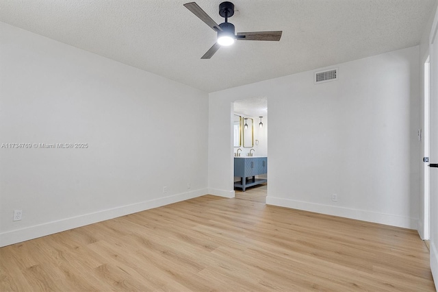 4050 NW 42nd Ave Unit 318, Fort Lauderdale, FL 33319 - unfurnished room featuring ceiling fan, a textured ceiling, and light hardwood / wood-style flooring