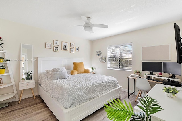 bedroom featuring ceiling fan and light hardwood / wood-style floors