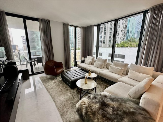 living room featuring plenty of natural light and floor to ceiling windows