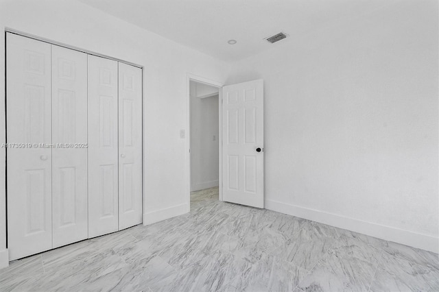 unfurnished bedroom featuring a closet