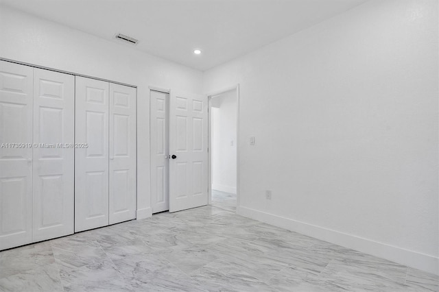 unfurnished bedroom featuring a closet