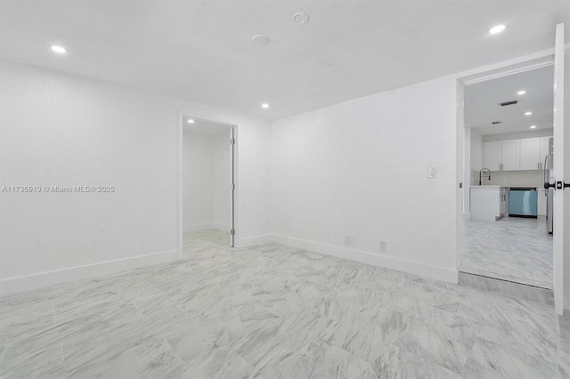 spare room featuring sink