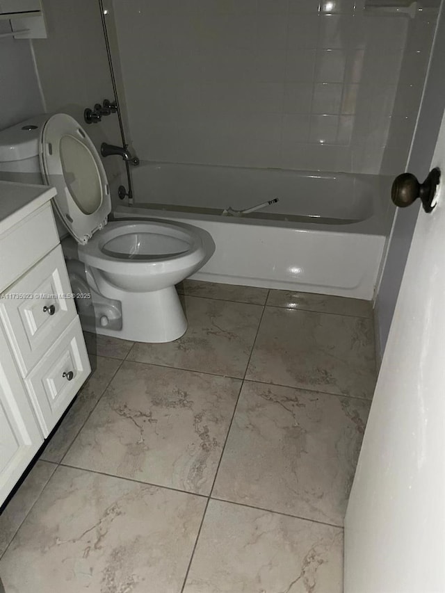 full bathroom featuring vanity, bathtub / shower combination, and toilet