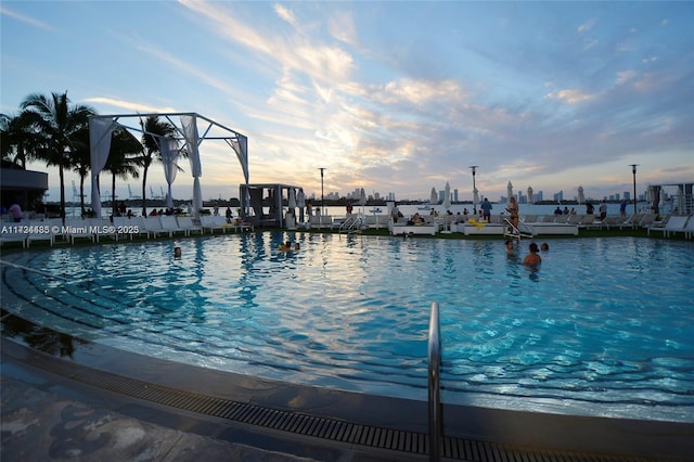 view of swimming pool with a water view