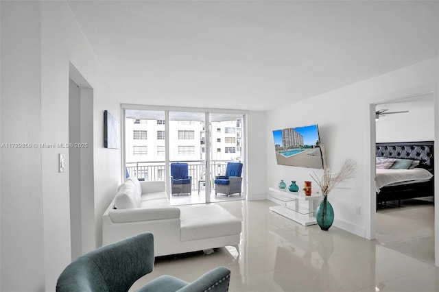 tiled living room with floor to ceiling windows