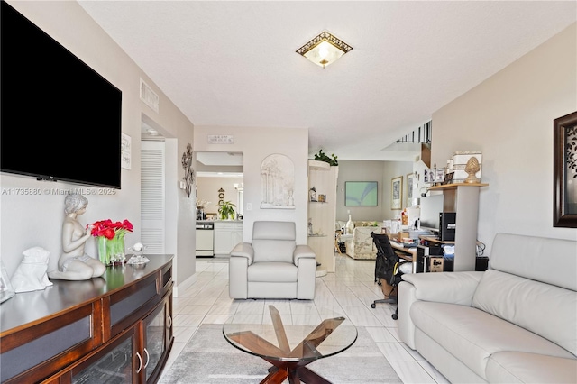 living room featuring light tile patterned floors