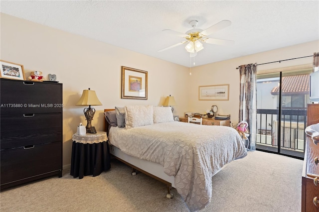 bedroom with ceiling fan, light carpet, access to exterior, and a textured ceiling