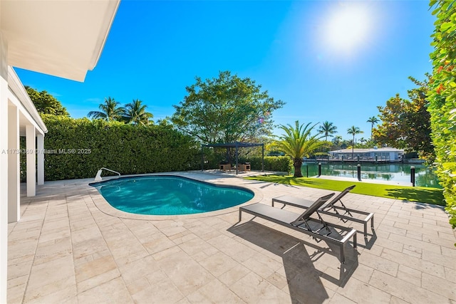 view of pool featuring a water view, a pergola, and a patio