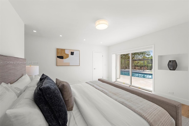 bedroom featuring wood-type flooring and access to exterior