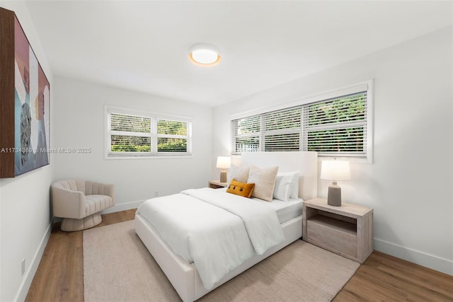 bedroom with light hardwood / wood-style flooring