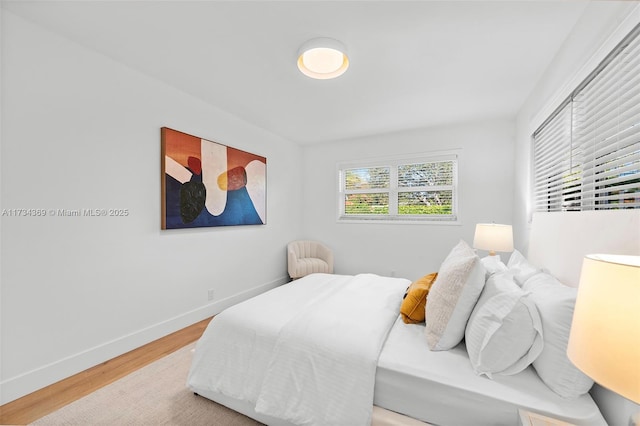 bedroom with wood-type flooring