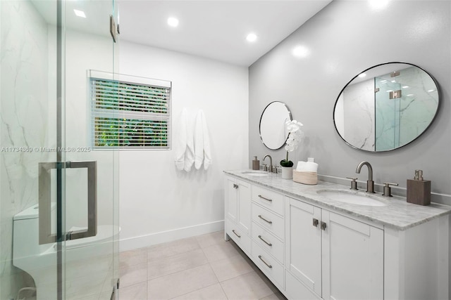 bathroom with vanity, tile patterned flooring, and walk in shower