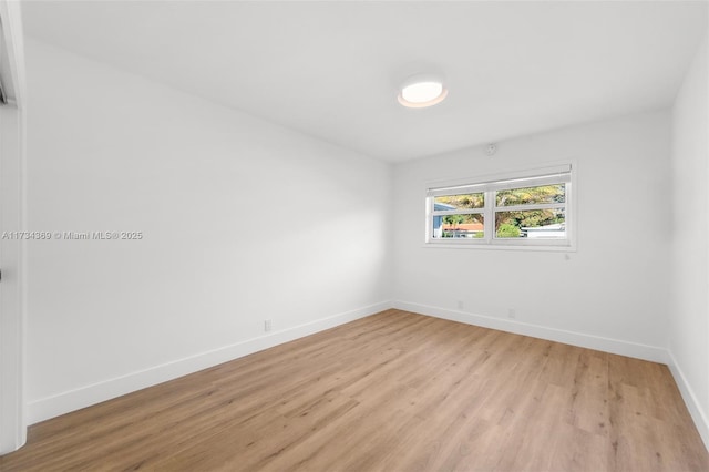 spare room featuring light hardwood / wood-style flooring