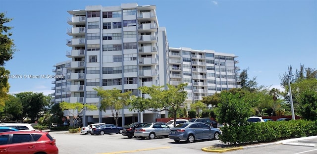 view of property featuring uncovered parking