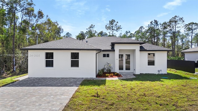 view of front of property featuring french doors and a front yard