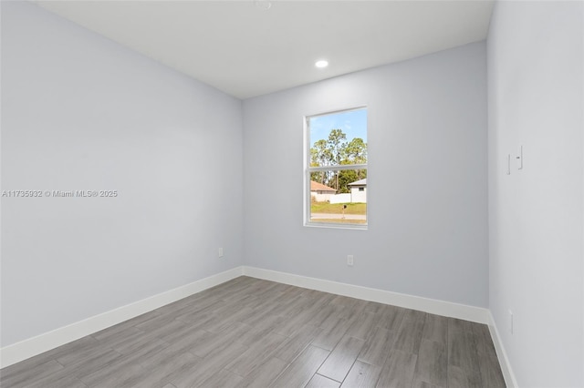 unfurnished room featuring light hardwood / wood-style flooring