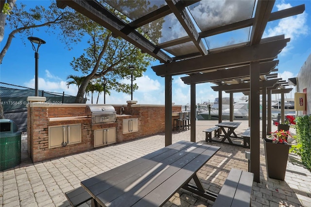 view of patio / terrace with an outdoor kitchen and area for grilling