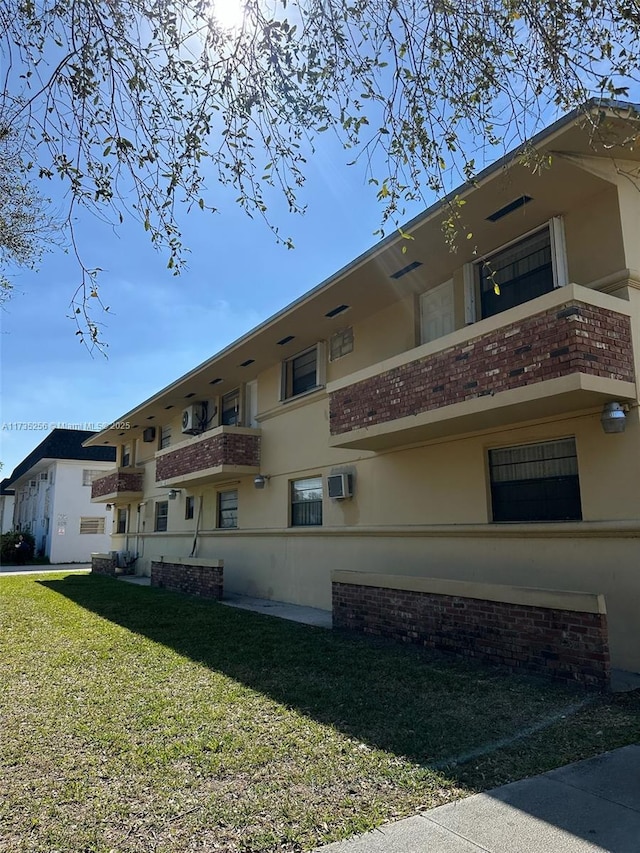 view of property featuring a wall mounted air conditioner