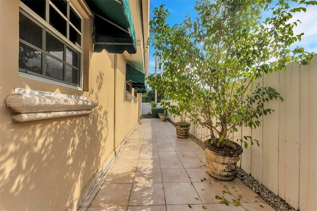 view of side of home with a patio area