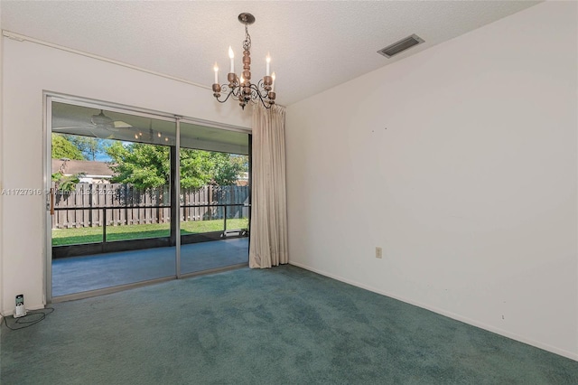 unfurnished room featuring carpet, a notable chandelier, and a textured ceiling