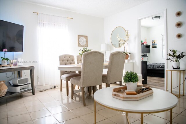 dining room with light tile patterned flooring