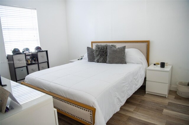 bedroom featuring dark hardwood / wood-style floors