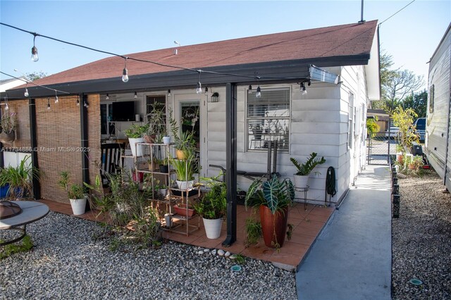 rear view of property featuring a patio