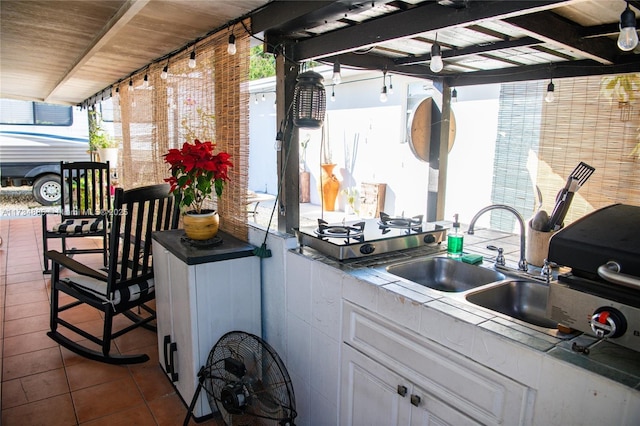 view of patio with exterior kitchen and sink