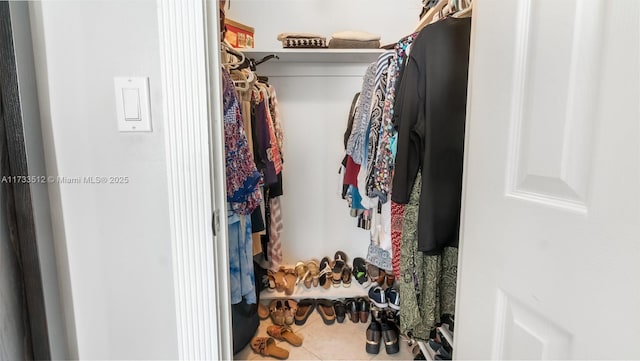 spacious closet with tile patterned flooring