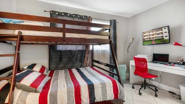 bedroom with light tile patterned floors