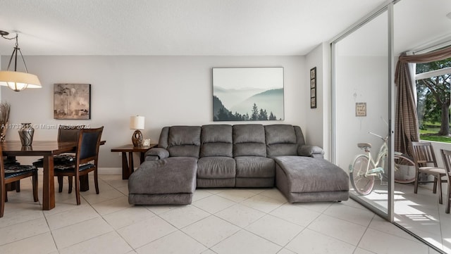 tiled living room with a textured ceiling