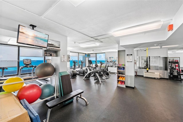 workout area with a textured ceiling