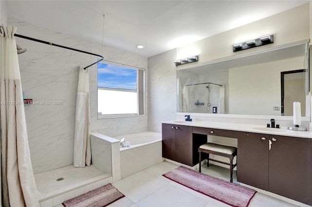 bathroom featuring shower with separate bathtub and vanity