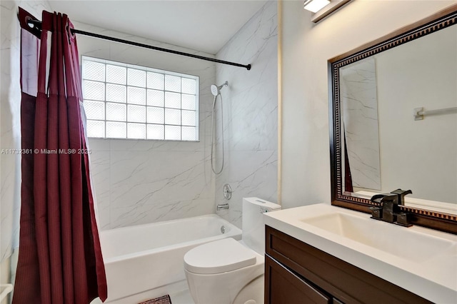 full bathroom with vanity, toilet, and shower / bath combo with shower curtain