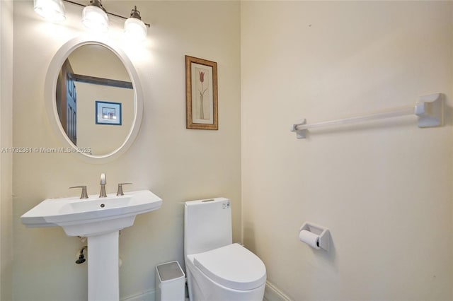 bathroom featuring toilet