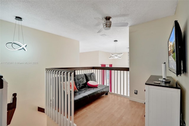 interior space featuring hardwood / wood-style floors and a textured ceiling