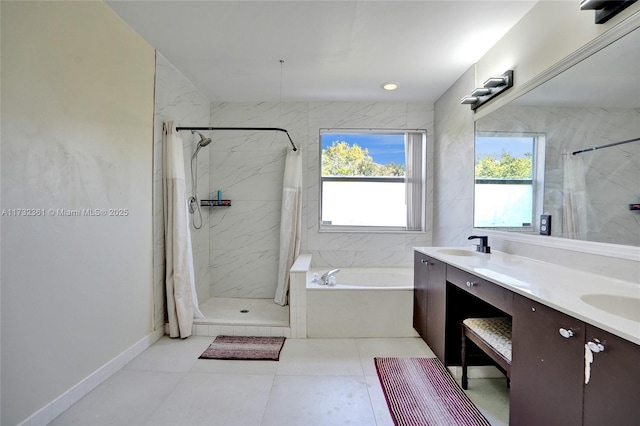 bathroom featuring vanity and separate shower and tub