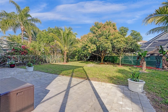 view of patio / terrace featuring glass enclosure