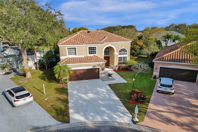 mediterranean / spanish-style house featuring a front yard