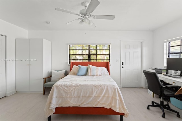 bedroom featuring ceiling fan and light wood-type flooring