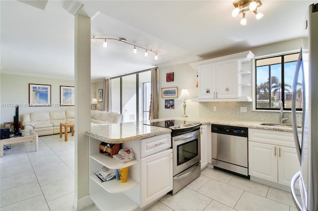 1605 S US Highway 1 Unit M1 # 106, Jupiter, FL 33477 - kitchen with open shelves, stainless steel appliances, a sink, a peninsula, and white cabinets