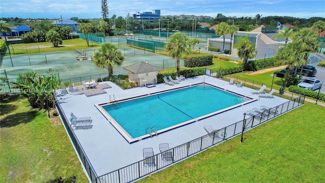 view of swimming pool featuring a yard and a patio area