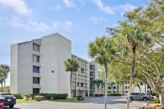 1605 S US Highway 1 Unit M1 # 106, Jupiter, FL 33477 - view of apartment building / complex with uncovered parking