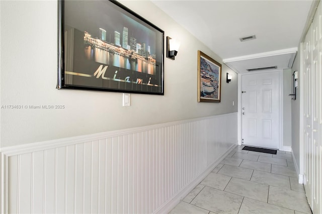 hall featuring light tile patterned floors