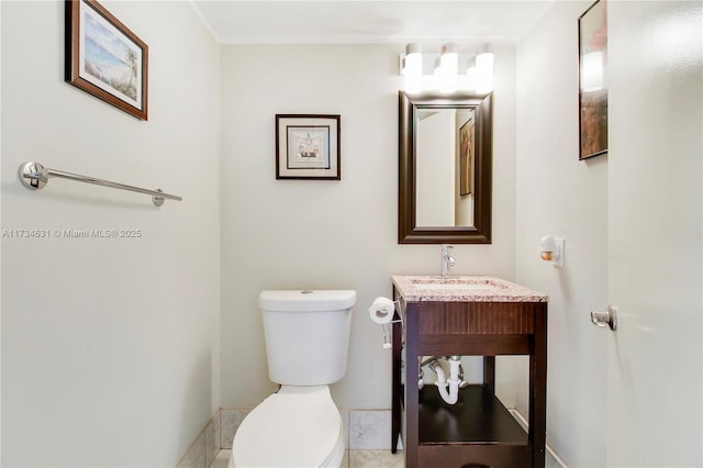 bathroom featuring toilet and sink