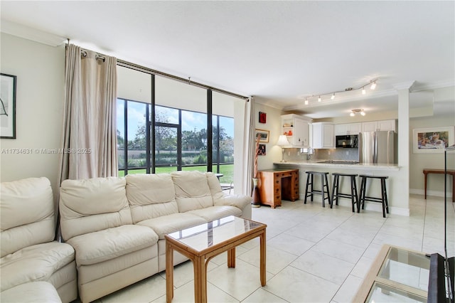 tiled living room with crown molding