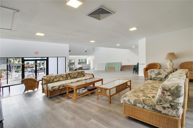 1605 S US Highway 1 Unit M1 # 106, Jupiter, FL 33477 - living room featuring attic access, light wood-type flooring, and recessed lighting