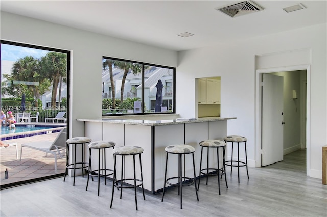 1605 S US Highway 1 Unit M1 # 106, Jupiter, FL 33477 - bar area featuring light wood-style flooring