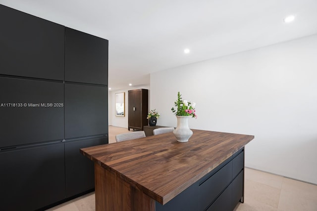 kitchen featuring wood counters and a center island